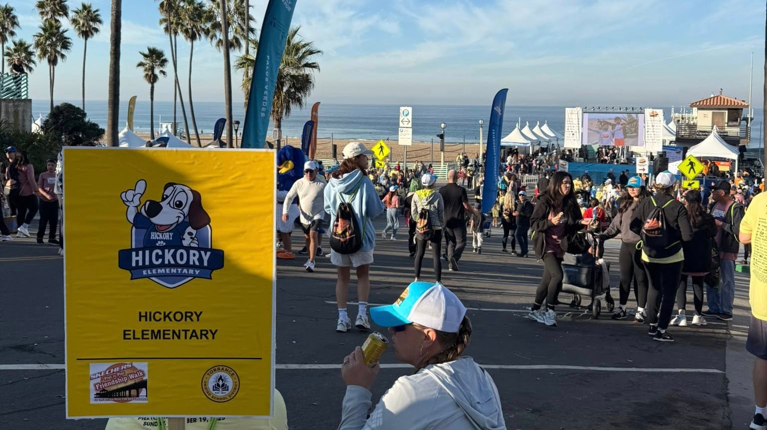Boy holding TEF sign at the 2017 Skechers Walk.